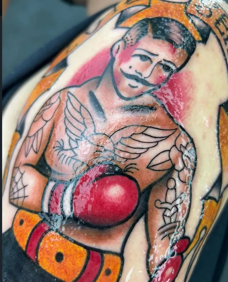 Tatuagem old school colorida de boxeador com luva vermelha